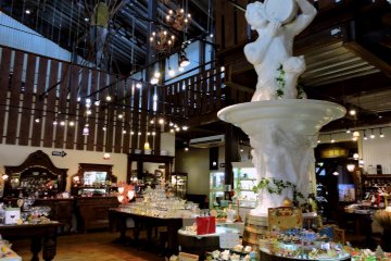 <p>A barn with chandeliers and statues</p>