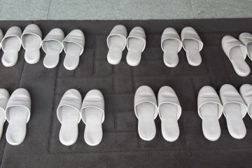 Shoes off at the entrance to the museum building