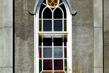 <p>A stained glass window catching the sunlight felt like it had been here forever</p>