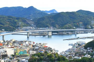 <p>Looking down upon Ushibuka-haiya Ohashi Bridge and the harbor from Suisen Park</p>