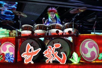 <p>The drummers pass by on large parade-like floats that seem to be controlled remotely&nbsp;</p>