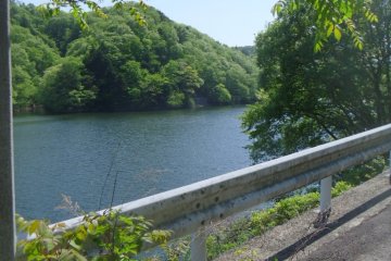 <p>There are a few parking spots around the lake; people come here to fish</p>