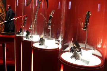 <p>Original (as denoted by the black card on the left of each model &ndash; white means replica) Sith&nbsp;lightsabre props used in the movies&nbsp;&copy; &amp; TM Lucasfilm Ltd.</p>