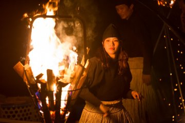 <p>Stoking the fires to attract the fish</p>