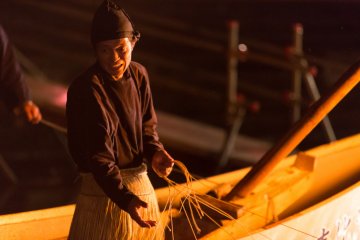 <p>The fisherman works a complex web of ropes</p>