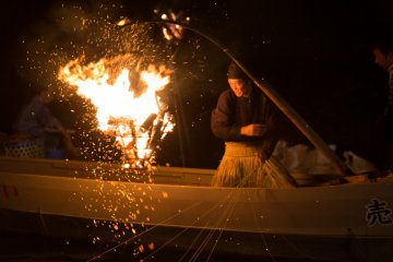 <p>Repositioning the fire to attract the fish</p>