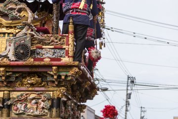 <p>Six wooden floats, dating to the Edo Period, make their way through the crowd</p>