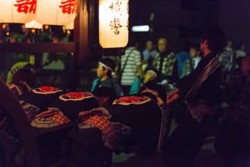 <p>Crew members pull the floats uphill towards a local shrine</p>