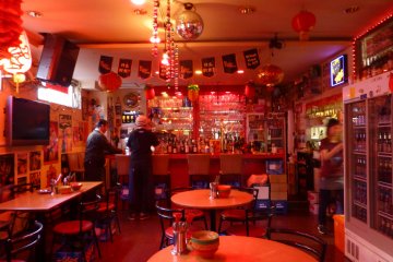 <p>Dim red lighting sets a great mood for a night in Singapore</p>