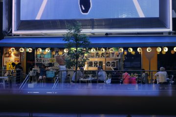 <p>One of the many riverside restaurants at Dotonbori.</p>