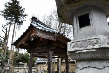 <p>Stone lantern and the water purification font in the back</p>