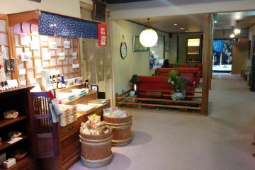 <p>The lobby offerings seating, a small tasteful gift shop, and the passage ways to the first floor baths or dining hall</p>