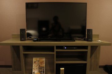 The TV has on-demand movies and speakers.