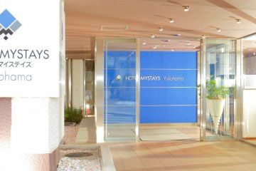 <p>The brightly lit entrance of HOTEL MYSTAYS Yokohama</p>
