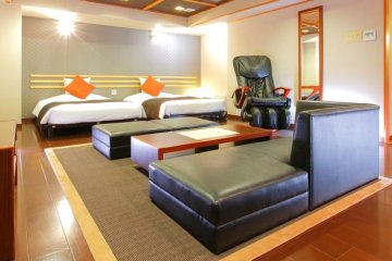 <p>A look inside the Grand Deluxe Twin room, complete with massage chair</p>