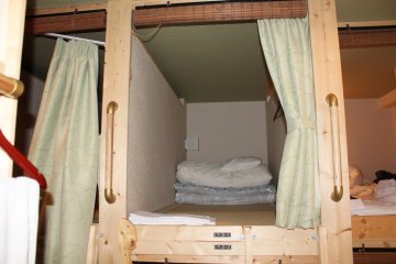 <p>Dorm style room with comfortable fold out mattress and curtain for privacy</p>