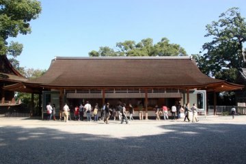 <p>Shinto priests sell ema plaques (wooden plaques onto which people write their prayer)&nbsp;to the public.</p>