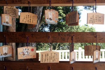 <p>Ema plaques on display; they&nbsp;are written on by visitors to the shrine detailing their wishes and plans for the future.</p>
