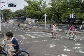 <p>Kids riding around the track complete with actual road signs and working traffic lights. Most of them follow the rules. Most.&nbsp;</p>