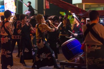 Drummers perform for the crowd before the festival gets under way