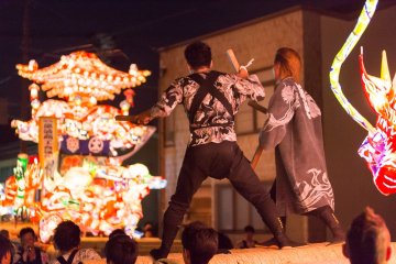 The floats parade through the crowds at the beginning of the festival