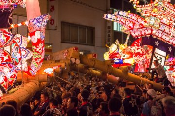 Two of the floats try to win by pushing each other back