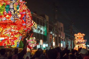 Two floats race towards each other and brace for collision