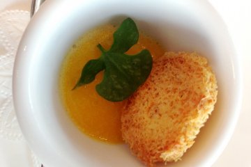 The amuse bouche is a foie gras with a mango and orange mousse. A touch of sweetness meets the rich terrine like pate, while the light crunch of the fresh parsley leaf adds to the texture.