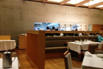 The calming walls are a counterpoint to the action inside the open kitchen.