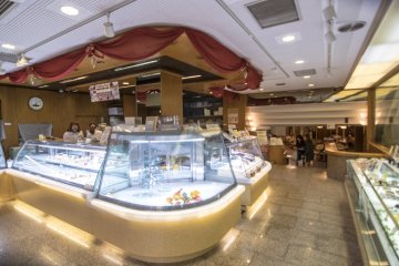 <p>The interior of the Mont-Blanc retains a quaint charm, and the&nbsp;caf&eacute;&nbsp;is located in the background.</p>