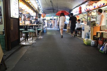 <p>The lady with a red umbrella is a great touch</p>