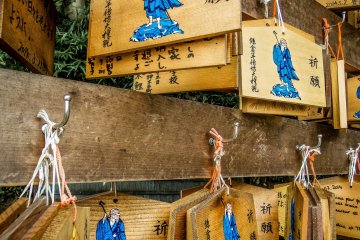 <p>Several wooden prayer tablets, where visitors can write their future wishes</p>