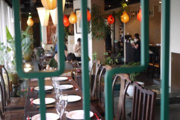 window, tables and lanterns