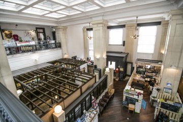 <p>The view from the second floor. While the architecture of the Bank is clearly distinct, the new tenants and their interesting shops make for a bizzare but very curious constrast with the existing infrastructure.</p>
