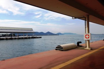 Green wooded islands and inlets surround Takamatsu port.