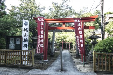 <p>An Inari Taisha around the grounds of Matsue Castle. The road was mostly desolated, and few visitors walk around here (due to the distance), but I recommend entering, and taking this route by bike.</p>