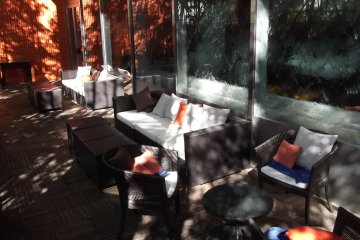 <p>The cool, relaxing outdoor terrace, behind the fountain windows</p>