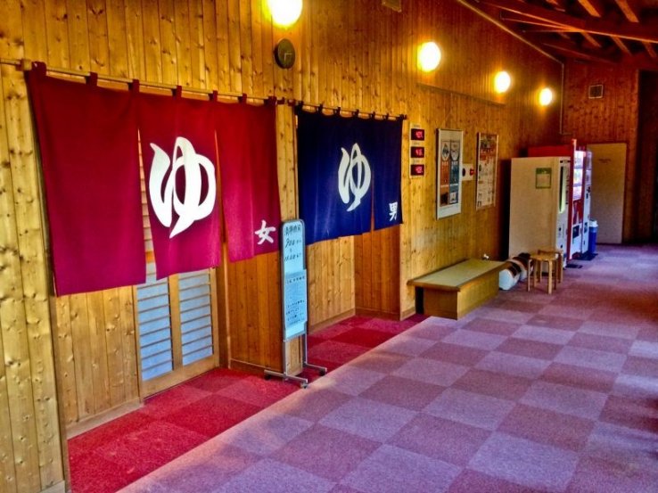 Almost all onsens have separate changing rooms and baths for men (blue curtain) and women (red curtain).