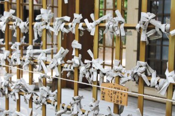 <p>Fortunes are tied to the front of the shrine &nbsp;</p>