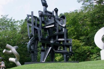 Great combination of green grass and trees and modern art
