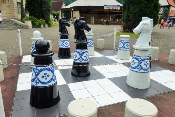 <p>A giant porcelain chess set in the park</p>