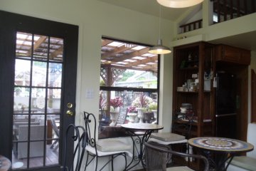 <p>Lovely and bright, but with air conditioning! You can see the outdoor seating area through the window.</p>