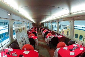 <p>A resturant on the top floor of the first two floor shinkansen with a kitchen directly below</p>