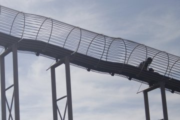 <p>A man and his son going down the slide.&nbsp;</p>