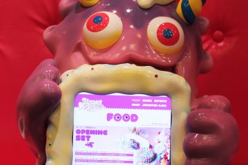 A monster friend holds up the menu for me!