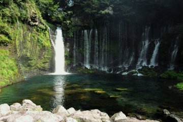 <p>The largest 'thread' of the waterfall flows into a small pool</p>