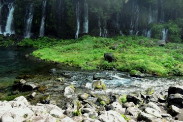 <p>Narrow falls all along one side of the river</p>