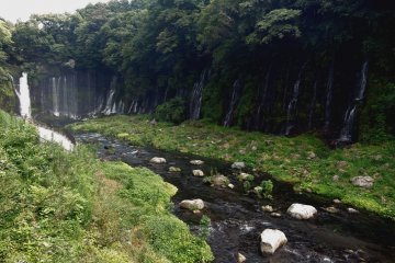 <p>A shallow, rocky river collects the water</p>