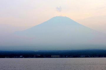 <p>A small puff of cloud hovered above Fuji's peak</p>