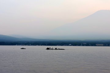<p>Barges carrying fireworks were owed out into the lake for the festival</p>